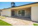 Covered patio overlooks a backyard featuring artificial grass and gravel at 17411 N 36Th St, Phoenix, AZ 85032