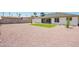 Large backyard space featuring gravel, lawn and perimeter landscaping at 17411 N 36Th St, Phoenix, AZ 85032