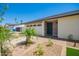Charming home featuring a well-manicured front yard, desert landscaping, and an inviting front entrance with a decorative door at 17411 N 36Th St, Phoenix, AZ 85032