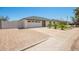Charming home featuring a well-maintained exterior, driveway, and beautifully landscaped front yard at 17411 N 36Th St, Phoenix, AZ 85032