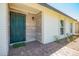 Charming front porch with brick and stone accents, offering a welcoming entrance at 17411 N 36Th St, Phoenix, AZ 85032