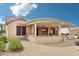 A backyard featuring an outdoor covered patio with decorative pergola and desert landscaping at 18013 N Sterling Dr, Surprise, AZ 85374