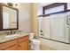 Cozy bathroom includes granite countertop vanity, toilet, and bath tub/shower combo at 18013 N Sterling Dr, Surprise, AZ 85374