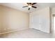 Bedroom with tile flooring and ceiling fan; features large closet and neutral wall color at 18013 N Sterling Dr, Surprise, AZ 85374