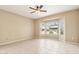 Bright, airy bedroom with tile floors, a ceiling fan, and large windows offering views of the surrounding neighborhood at 18013 N Sterling Dr, Surprise, AZ 85374