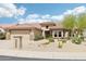 Charming single-story home with desert landscaping, tile roof, and inviting curb appeal under a bright blue sky at 18013 N Sterling Dr, Surprise, AZ 85374