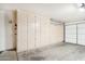 Spacious garage featuring built-in storage cabinets along the back wall, and an automatic door at 18013 N Sterling Dr, Surprise, AZ 85374