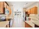 Bright kitchen with stainless appliances, ample counter space, and view into adjoining eating area at 18013 N Sterling Dr, Surprise, AZ 85374