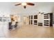 Open-concept living space with a breakfast bar, fireplace, and tile flooring, ideal for modern living at 18013 N Sterling Dr, Surprise, AZ 85374