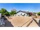 Concrete backyard includes a patio, landscaping, and privacy wall at 1837 E Presidio Rd, Phoenix, AZ 85022