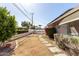 Landscaped backyard has a stone pathway and mature shrubbery at 1837 E Presidio Rd, Phoenix, AZ 85022