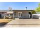 Covered patio with view of backyard featuring mature trees and landscaping at 1837 E Presidio Rd, Phoenix, AZ 85022
