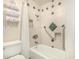 Clean bathroom featuring decorative tiled shower, a towel rack, and sleek, modern fixtures at 1837 E Presidio Rd, Phoenix, AZ 85022