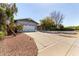Charming single-story home featuring an attached two-car garage and mature landscaping at 1837 E Presidio Rd, Phoenix, AZ 85022