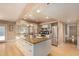 Spacious kitchen features large island with granite countertops, stainless steel appliances, and wood flooring at 1837 E Presidio Rd, Phoenix, AZ 85022