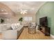 Comfortable living room with hardwood floors, vaulted ceiling, and a serene atmosphere at 1837 E Presidio Rd, Phoenix, AZ 85022