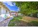Expansive backyard with lush greenery and mature trees creating a private oasis at 1849 E Jarvis Ave, Mesa, AZ 85204