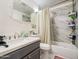 Updated bathroom with modern vanity, fixtures, and shower over tub combo at 1849 E Jarvis Ave, Mesa, AZ 85204