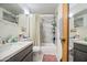 Bright bathroom with updated vanity, marble style shower, and tub combo at 1849 E Jarvis Ave, Mesa, AZ 85204