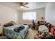 Simple bedroom with a ceiling fan, a window, and basic furnishings at 1849 E Jarvis Ave, Mesa, AZ 85204