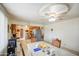 View of dining area with an open kitchen in the background, featuring a ceiling fan at 1849 E Jarvis Ave, Mesa, AZ 85204