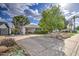 Charming single-story home with a well-maintained front yard and a long driveway with a covered carport at 1849 E Jarvis Ave, Mesa, AZ 85204
