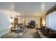 Open-concept living room with cozy seating, neutral decor, and ample natural light at 1849 E Jarvis Ave, Mesa, AZ 85204