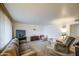 Spacious living room featuring plush carpeting, neutral-toned walls, and comfortable seating at 1849 E Jarvis Ave, Mesa, AZ 85204