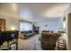 Spacious living room featuring plush carpeting, neutral-toned walls, and comfortable seating at 1849 E Jarvis Ave, Mesa, AZ 85204