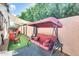 Outdoor space features a cozy swing, patio furniture, and lush greenery for relaxing and entertaining at 20017 S 192Nd Pl, Queen Creek, AZ 85142