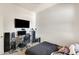 Bedroom with a tv, desk, and dark bedding at 20017 S 192Nd Pl, Queen Creek, AZ 85142