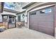 Attached two-car garage with updated door on a home featuring attractive brick accents and paver driveway at 20017 S 192Nd Pl, Queen Creek, AZ 85142