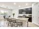 Well-designed kitchen with center island, dark cabinets, and dining area that's perfect for casual meals at 20017 S 192Nd Pl, Queen Creek, AZ 85142