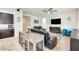 Open-concept living room featuring leather recliners, ceiling fan, and stylish decor at 20017 S 192Nd Pl, Queen Creek, AZ 85142