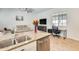 Open living area showcasing a modern kitchen with granite counters and seamless transitions to the comfortable living space at 20017 S 192Nd Pl, Queen Creek, AZ 85142