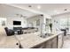 Open layout kitchen, dining, and living space with lots of natural light at 20017 S 192Nd Pl, Queen Creek, AZ 85142