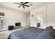 Primary bedroom featuring neutral color palette, ceiling fan, and access to bathroom at 20017 S 192Nd Pl, Queen Creek, AZ 85142