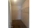 Spacious walk-in closet with ample shelving and hanging space for organized storage at 2028 E Libby St, Phoenix, AZ 85022