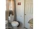 Toilet in a bathroom with a light-colored walls at 2028 E Libby St, Phoenix, AZ 85022