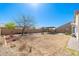 Spacious backyard featuring an outdoor gazebo with patio furniture and landscaped gravel at 2031 S 86Th Ln, Tolleson, AZ 85353