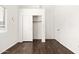 Bright bedroom with hardwood floors, closet and attached bathroom at 2031 S 86Th Ln, Tolleson, AZ 85353