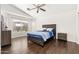 Bedroom featuring laminate wood flooring, vaulted ceiling, window with blinds and neutral paint at 2031 S 86Th Ln, Tolleson, AZ 85353