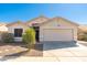 Charming single-story home with a well-maintained lawn, desert landscaping and a two-car garage at 2031 S 86Th Ln, Tolleson, AZ 85353