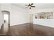 Living room with laminate flooring, ceiling fan, and views to other parts of the home at 2031 S 86Th Ln, Tolleson, AZ 85353