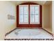 Close-up of soaking tub with tile accents, and white shuttered windows at 20609 N Canyon Whisper Dr, Surprise, AZ 85387