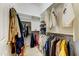 Organized walk-in closet with clothing racks, shelving, and plenty of room for storage at 20609 N Canyon Whisper Dr, Surprise, AZ 85387