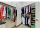 Walk-in closet offering ample storage space with custom shelving, rods, and built-in drawers at 20609 N Canyon Whisper Dr, Surprise, AZ 85387