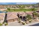 Beautiful desert landscaping surrounds this home featuring a three-car garage at 20609 N Canyon Whisper Dr, Surprise, AZ 85387