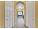 Inviting foyer leading to living areas with arched openings and neutral color scheme at 20609 N Canyon Whisper Dr, Surprise, AZ 85387