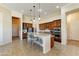 Spacious kitchen featuring a large island with seating, stainless steel appliances, and ample cabinet space at 20609 N Canyon Whisper Dr, Surprise, AZ 85387